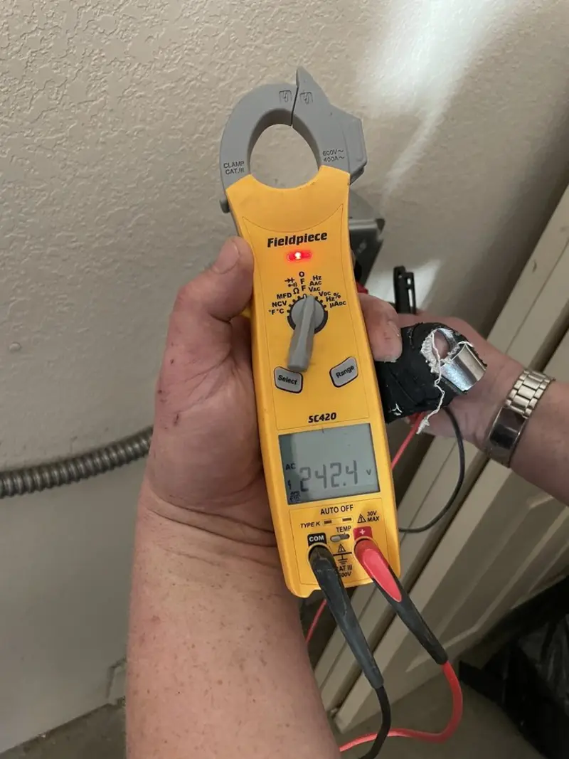 Voltage testing with clamp meter during Ceiling Fan Installation in New Providence